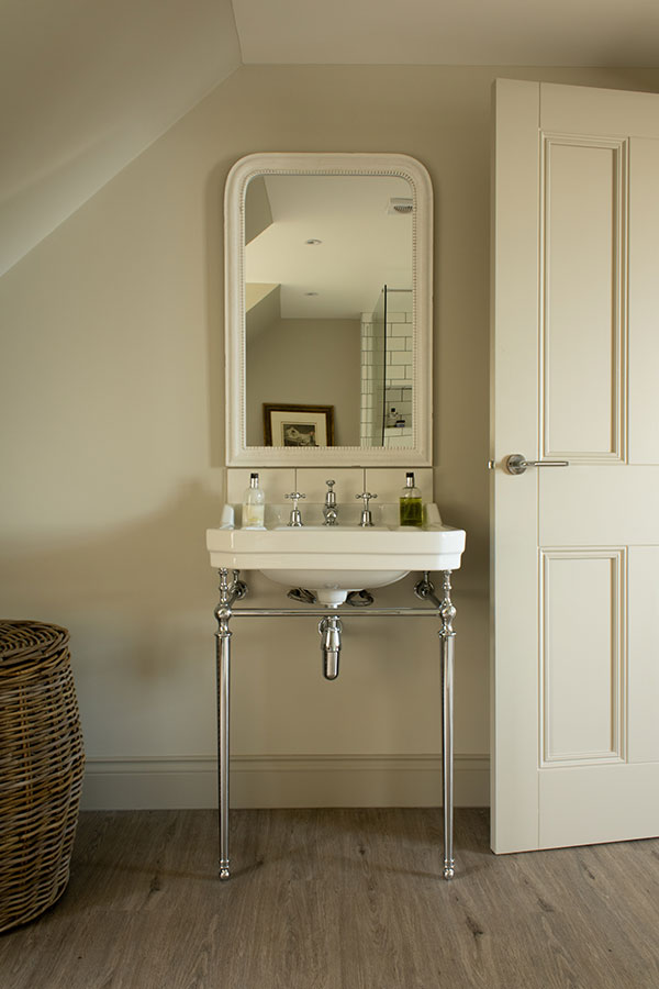 En Suite bathroom with chrome washstand.